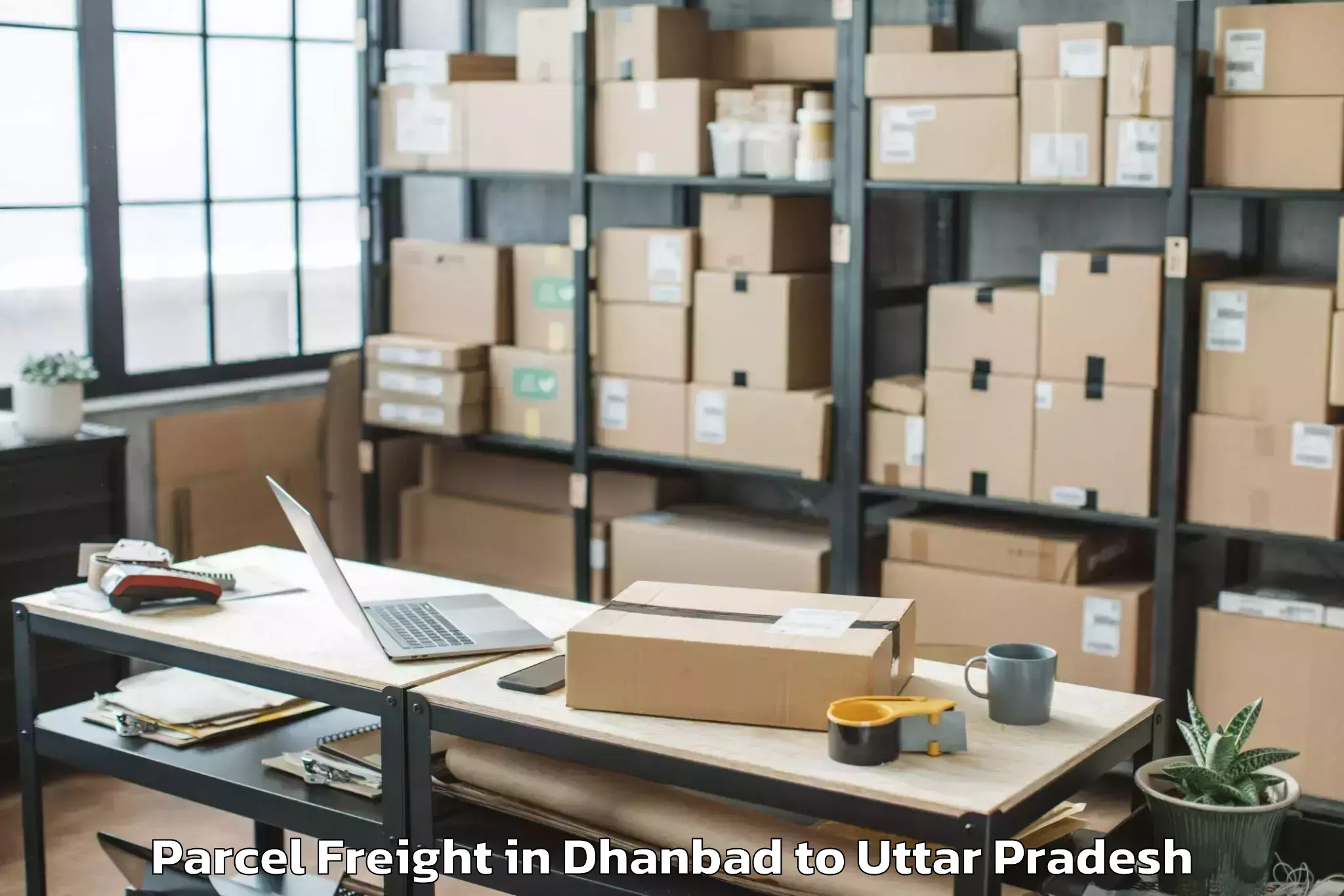 Dhanbad to Ghanghata Parcel Freight Booking